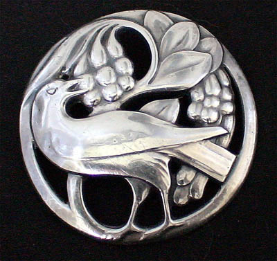 Early Jensn bird eating berried brooch circa 1908